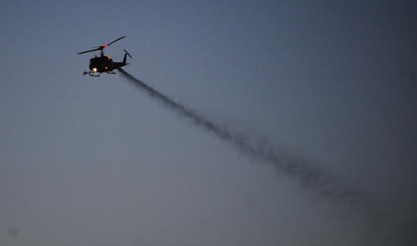 Image result for spraying chemicals helicopter